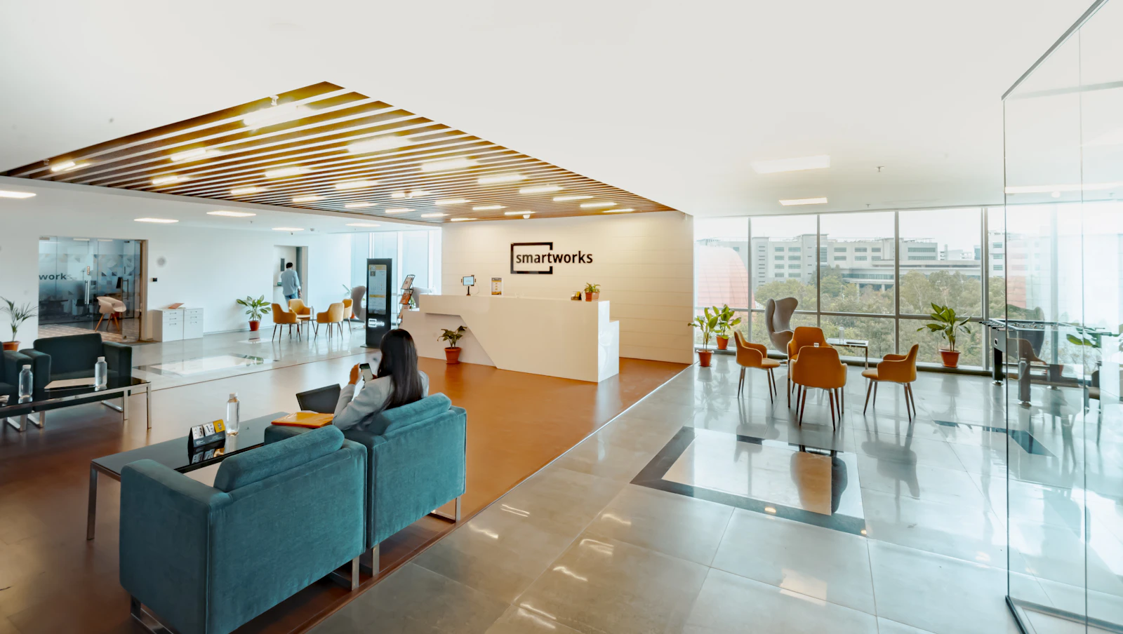 People meeting in a staffed office reception area