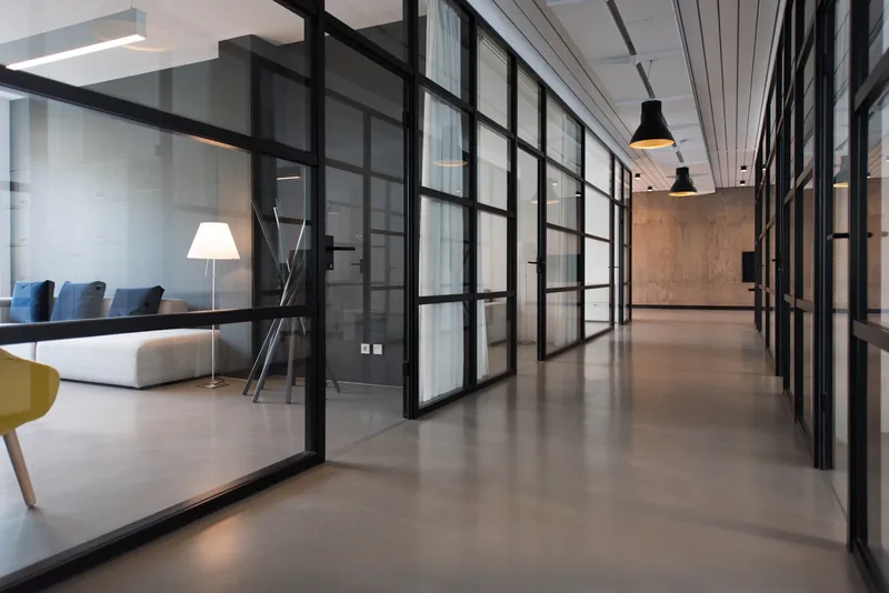 An office corridor with business meeting rooms