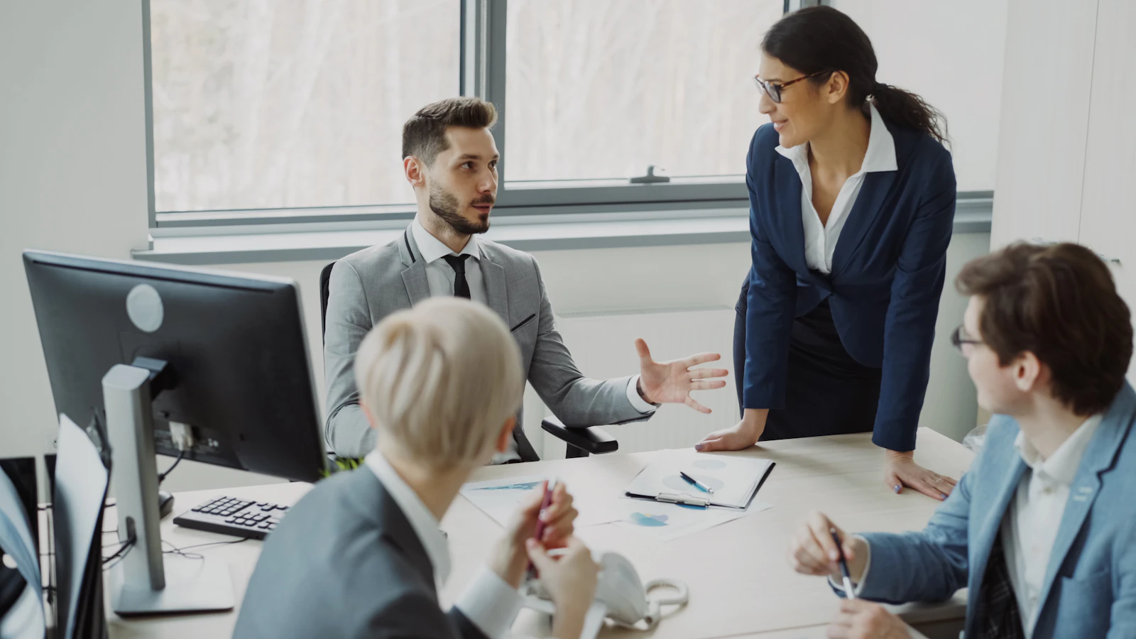 Business professionals collaborating in a modern office meeting