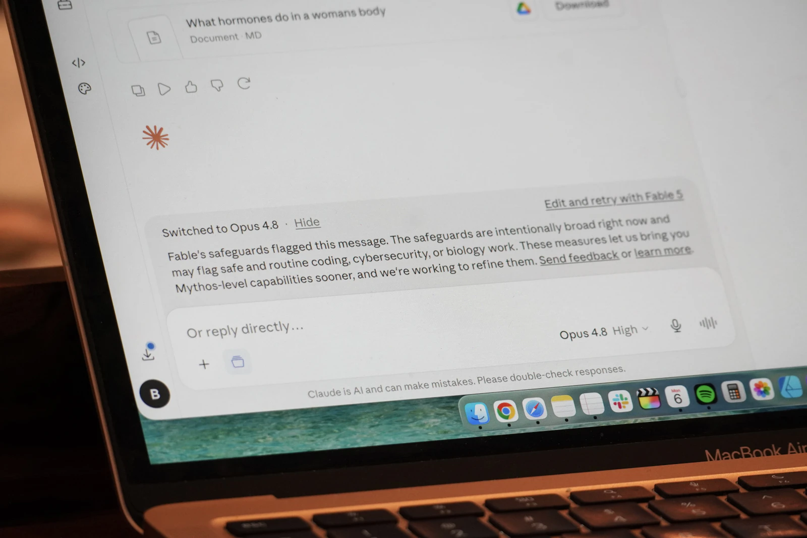 An AI conversation displayed on a real laptop