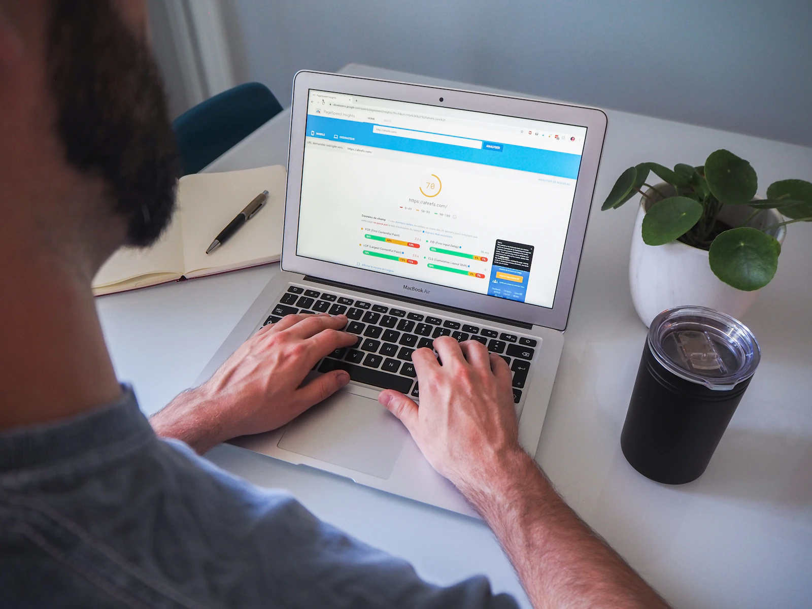 A marketer examining search-performance charts on a laptop